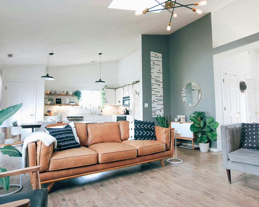 a leather couch in a bright and tidy living room