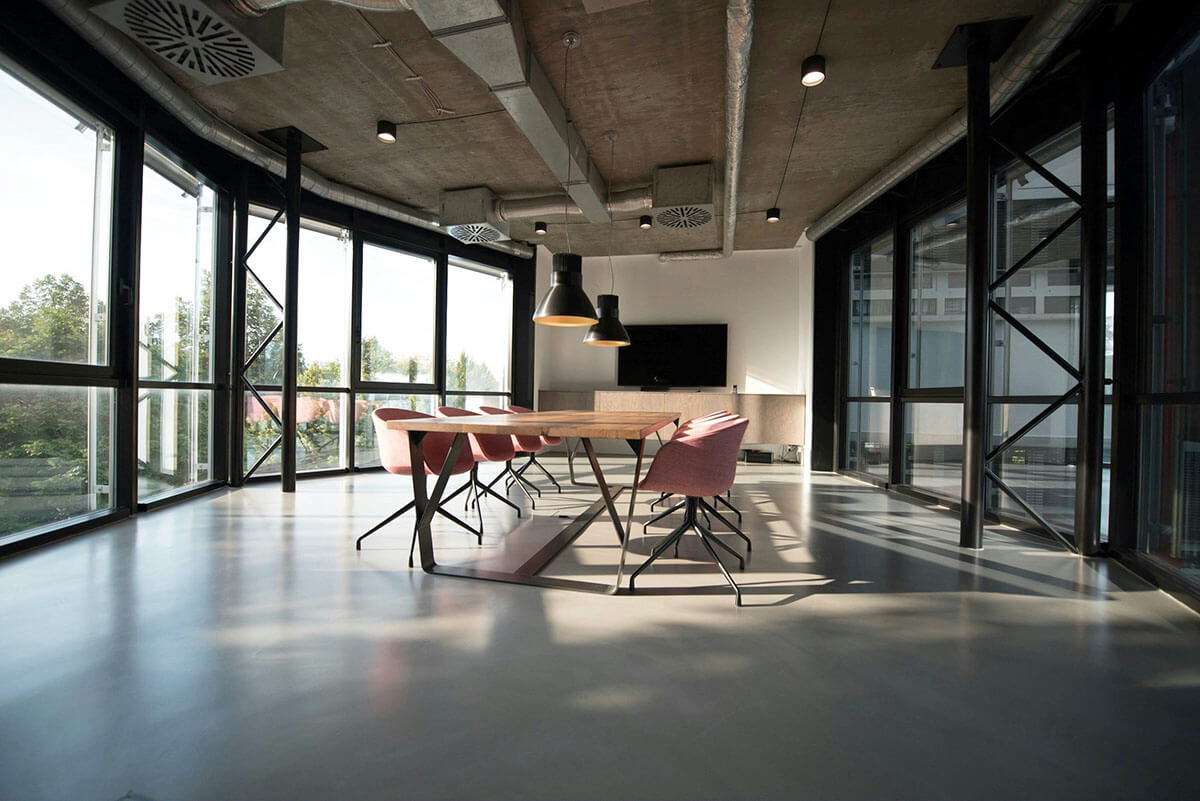 a board room with modern finishes and large floor to ceiling windows